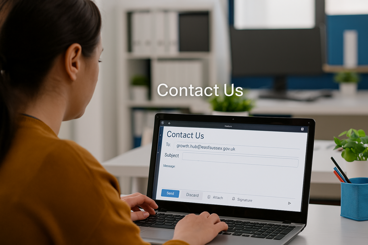 business person emailing the East Sussex Growth Hub
